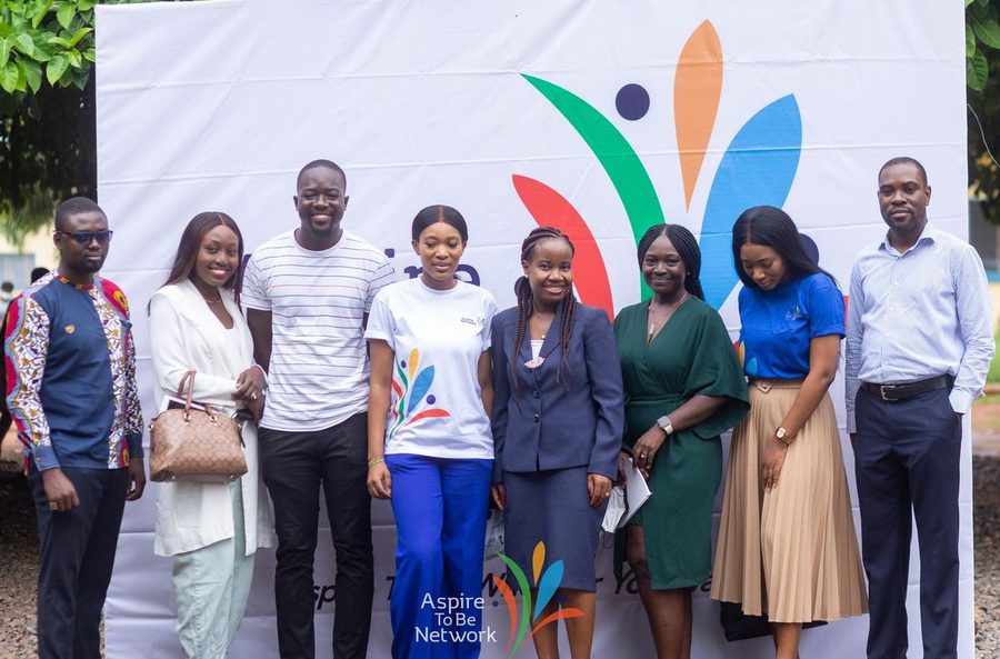 The Aspire To Be Network team with students