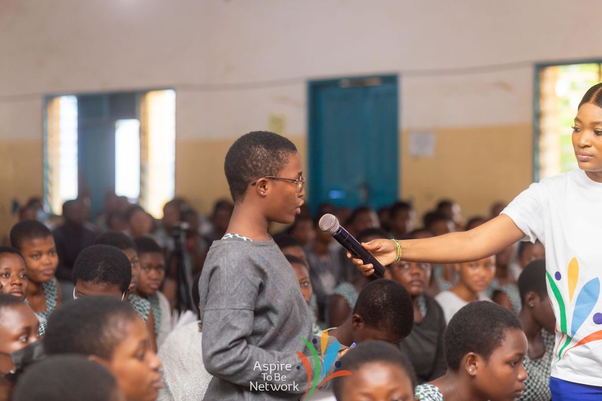 A student asking a question during the session