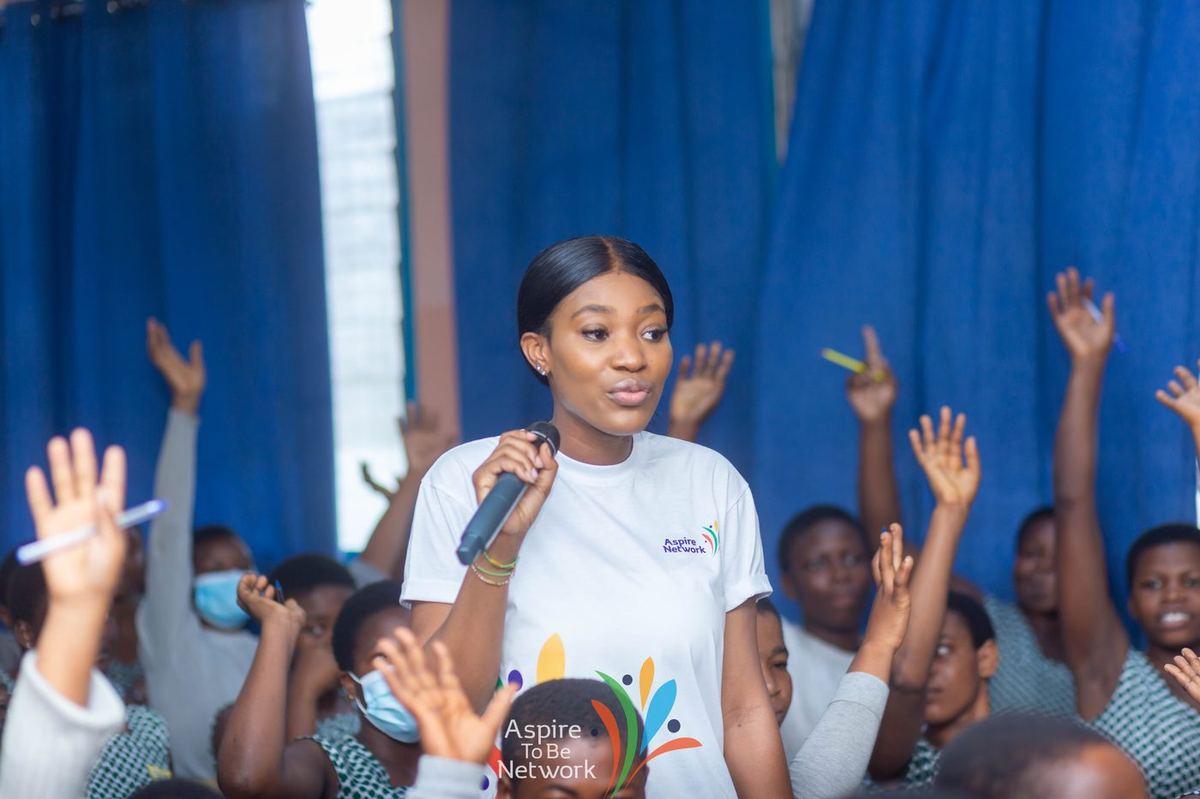 Students raising their hands to answer during the Labone engagement